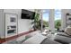 Bright living room featuring a balcony, hardwood floors, and modern décor at 711 Cosmopolitan Ne Dr # 625, Atlanta, GA 30324