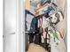 Well-organized walk-in closet featuring ample storage and closet space for clothing and accessories at 711 Cosmopolitan Ne Dr # 625, Atlanta, GA 30324