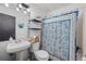 Cozy bathroom featuring a bright shower curtain, enhancing the bathing space at 962 Brighton Dr, Lawrenceville, GA 30043