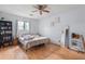 Bright bedroom features wood floors and natural light, creating a calming retreat at 962 Brighton Dr, Lawrenceville, GA 30043