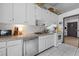 Functional kitchen with white cabinets and appliances providing ample storage and workspace at 962 Brighton Dr, Lawrenceville, GA 30043