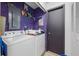 Functional laundry room featuring a washer and dryer, offering convenience and efficiency at 962 Brighton Dr, Lawrenceville, GA 30043