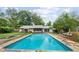 In-ground pool with ample space for relaxation and recreation with a patio area to enjoy outdoor living at 962 Brighton Dr, Lawrenceville, GA 30043