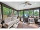 Bright sunroom offering views of the lush surrounding greenery and a tranquil atmosphere at 962 Brighton Dr, Lawrenceville, GA 30043