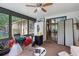 Cozy sunroom with bright windows and a ceiling fan, bringing the outdoors inside at 962 Brighton Dr, Lawrenceville, GA 30043