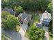 Aerial view of a two-story home with mature trees and a long driveway at 112 Birchwood Pass, Canton, GA 30114