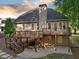 Spacious backyard featuring a multi-level deck and a walkout basement, ideal for entertaining and relaxation at 112 Birchwood Pass, Canton, GA 30114