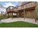 Two level backyard deck with grassy area and concrete patio at 112 Birchwood Pass, Canton, GA 30114