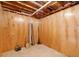 Unfinished basement with paneled walls and exposed beams, great for storage at 112 Birchwood Pass, Canton, GA 30114
