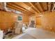 Unfinished basement with exposed beams, paneled walls, and a small window at 112 Birchwood Pass, Canton, GA 30114