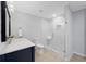Bathroom with white quartz countertop, navy vanity, and glass enclosed shower at 112 Birchwood Pass, Canton, GA 30114