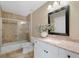 Bathroom featuring a granite countertop, white vanity, and tiled shower at 112 Birchwood Pass, Canton, GA 30114