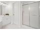 Clean bathroom with a glass-door shower, a white vanity, and bright lighting at 112 Birchwood Pass, Canton, GA 30114