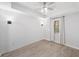 Spacious bedroom featuring wood flooring, white shiplap wall, and tray ceiling with fan at 112 Birchwood Pass, Canton, GA 30114