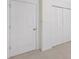 Hallway featuring multiple doors at 112 Birchwood Pass, Canton, GA 30114