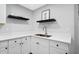 Modern kitchen with white cabinets, quartz countertops, and stainless steel sink at 112 Birchwood Pass, Canton, GA 30114