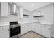 Clean kitchen with white cabinets, white countertops, and stainless steel appliances for a modern look at 112 Birchwood Pass, Canton, GA 30114