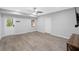 Large living room with walk-out door and windows and modern grey vinyl flooring at 112 Birchwood Pass, Canton, GA 30114
