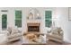 Cozy living room with fireplace, hardwood floors, and natural light at 112 Birchwood Pass, Canton, GA 30114