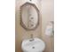 Powder room featuring an octagonal mirror and silver faucet at 112 Birchwood Pass, Canton, GA 30114