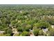 Aerial view of a home in a neighborhood surrounded by mature trees at 170 Mayfield Cir, Alpharetta, GA 30009