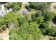 Aerial view of the house and surrounding lush, green trees, providing privacy at 170 Mayfield Cir, Alpharetta, GA 30009