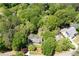 Aerial view of a house surrounded by lots of mature trees and foliage at 170 Mayfield Cir, Alpharetta, GA 30009
