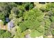 Aerial view of house surrounded by lots of mature trees and foliage at 170 Mayfield Cir, Alpharetta, GA 30009