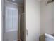 Small bathroom featuring a glass enclosed shower and window with blinds at 170 Mayfield Cir, Alpharetta, GA 30009