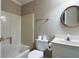 Compact bathroom featuring a shower-tub combo, toilet, and vanity at 170 Mayfield Cir, Alpharetta, GA 30009