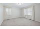 Bedroom featuring neutral carpet, crown molding, and natural light from shuttered windows at 170 Mayfield Cir, Alpharetta, GA 30009