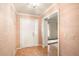 Inviting foyer with parquet flooring and textured walls, leading to the rest of the home at 170 Mayfield Cir, Alpharetta, GA 30009