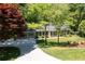 Ranch-style home featuring an attached two-car garage, beautiful landscaping, and a long driveway at 170 Mayfield Cir, Alpharetta, GA 30009