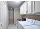 Convenient laundry room area with cabinets and sink at 170 Mayfield Cir, Alpharetta, GA 30009
