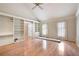Bright living room featuring hardwood floors, vaulted ceiling and large windows at 170 Mayfield Cir, Alpharetta, GA 30009