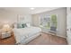 Cozy bedroom with a large window, soft carpet, and a comfortable bed at 2100 Baywood Sw Blvd, Austell, GA 30106