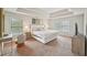 Spacious main bedroom featuring a tray ceiling, plush carpet, and a sitting area at 2100 Baywood Sw Blvd, Austell, GA 30106