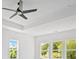 Bright bedroom with ceiling fan, trey ceiling, and plenty of natural light at 6520 Pond View Dr, Cumming, GA 30028