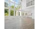 Spacious living room with hardwood floors, large windows, and open floor plan at 6520 Pond View Dr, Cumming, GA 30028
