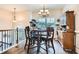 Cozy dining area with a traditional table and chairs, illuminated by a chandelier at 79 Little Creek Manor Dr, Dallas, GA 30157