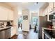 Modern kitchen featuring white cabinets, granite countertops, and stainless steel appliances at 79 Little Creek Manor Dr, Dallas, GA 30157