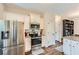 Well-lit kitchen with white cabinets, stainless steel appliances, and granite countertops for a modern feel at 79 Little Creek Manor Dr, Dallas, GA 30157