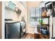 Modern laundry room with gray washer and dryer and ample storage at 79 Little Creek Manor Dr, Dallas, GA 30157