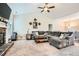 Cozy living room boasts vaulted ceilings, a stone fireplace, and comfortable seating at 79 Little Creek Manor Dr, Dallas, GA 30157