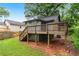 Back exterior view featuring a wooden deck and a well-maintained backyard at 944 Deckner Sw Ave, Atlanta, GA 30310