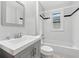 Clean bathroom featuring a shower-tub combo, neutral tiles, and a modern sink at 944 Deckner Sw Ave, Atlanta, GA 30310