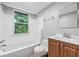 Bright bathroom with a shower-tub combo, and a vanity with drawers at 944 Deckner Sw Ave, Atlanta, GA 30310