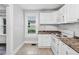 Bright kitchen with white appliances and a large window for natural light at 944 Deckner Sw Ave, Atlanta, GA 30310