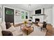 Inviting living room with a cozy fireplace, plush seating, and natural light at 944 Deckner Sw Ave, Atlanta, GA 30310