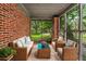 Cozy screened porch with comfortable seating, perfect for enjoying the outdoors at 944 Deckner Sw Ave, Atlanta, GA 30310